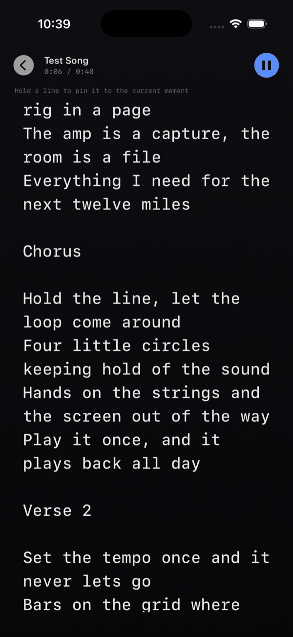 The full-screen lyrics teleprompter mid-song, showing the track name and the time readout at the top with a pause button, the scrolling verse text, and the hint line: Hold a line to pin it to the current moment.